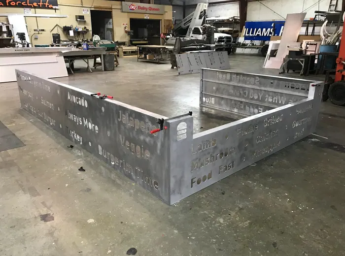 Custom metal structure with cutout lettering
